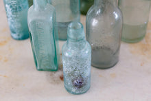 Load image into Gallery viewer, Selection of vintage glass bottles
